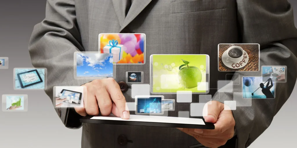 Businessman in a suit interacting with floating digital images and icons.